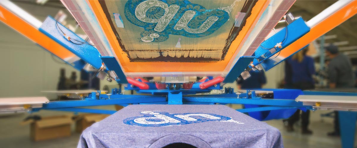 Custom printed t-shirt on a screen print press