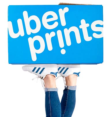 Holding up an UberPrints shipping box.