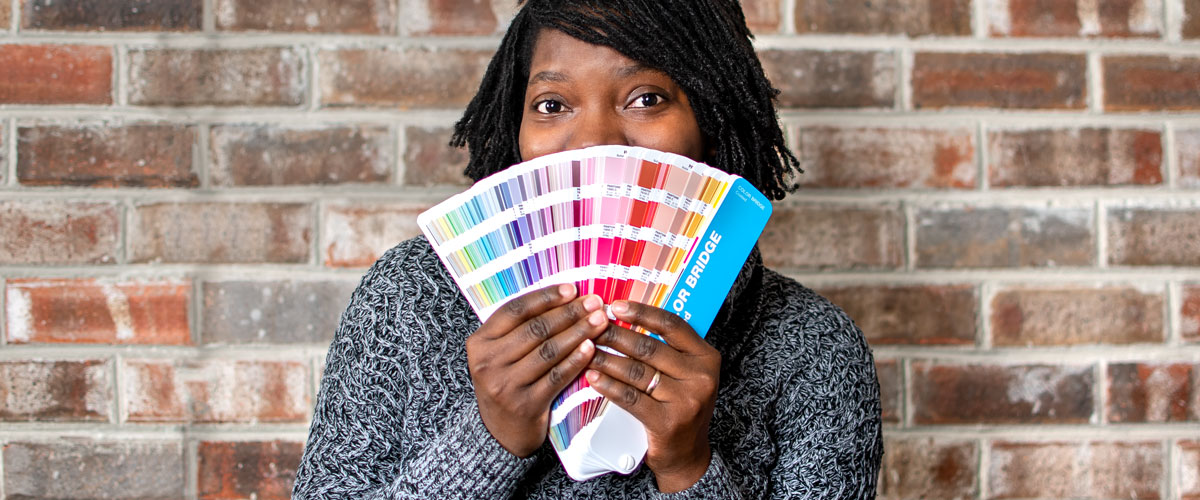 Artist showing a Pantone guide